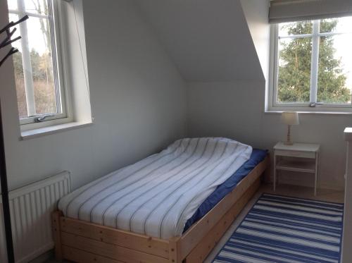 Ένα ή περισσότερα κρεβάτια σε δωμάτιο στο Ny Flintarp