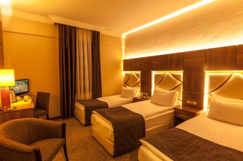 Katil atau katil-katil dalam bilik di Rumi Hotel