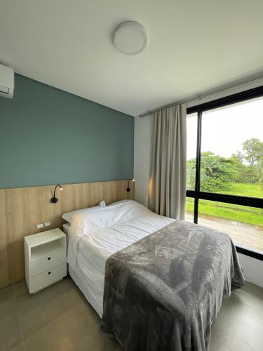 Cama ou camas em um quarto em Village dos Gerânios