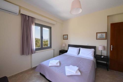 Ένα ή περισσότερα κρεβάτια σε δωμάτιο στο Seaside Villa AndroNikos (Evia Island)