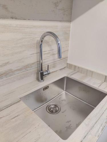 a kitchen counter with a sink in a kitchen at Casa Bianca in Cala Vadella