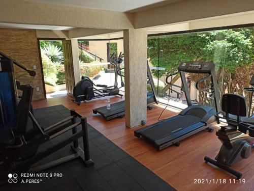 a gym with several treadmills and exercise equipment at Rio Búzios Beach Hotel in Búzios