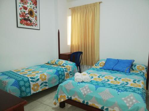 Postel nebo postele na pokoji v ubytování Hotel Real Pólux