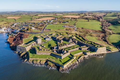 an aerial view of a castle on a island in the water at Marina views, Kinsale, Hosted by Exquisite holiday homes, sleeps 20 in Kinsale
