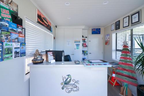 a room with a counter with a christmas tree in it at Gables Lakefront Resort in Taupo