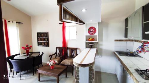 a kitchen with a table and a dining room at Private Study Punta Cana in Punta Cana