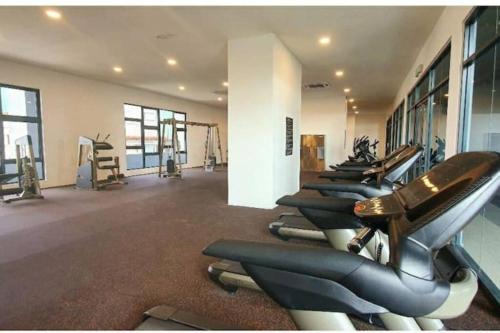 a row of pilates equipment in a gym at Apple Home 1 @ Menara Simfoni/Symphony Tower C180/Cheras/Mines/Balakong/Kuala Lumpur in Seri Kembangan