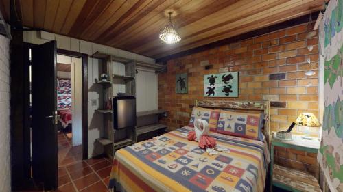 Ένα ή περισσότερα κρεβάτια σε δωμάτιο στο Hotel Pousada Praia do Farol