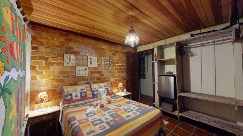 Ένα ή περισσότερα κρεβάτια σε δωμάτιο στο Hotel Pousada Praia do Farol