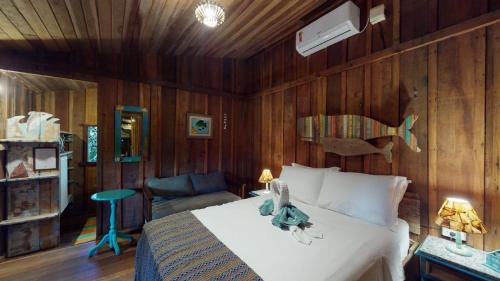 Ένα ή περισσότερα κρεβάτια σε δωμάτιο στο Hotel Pousada Praia do Farol