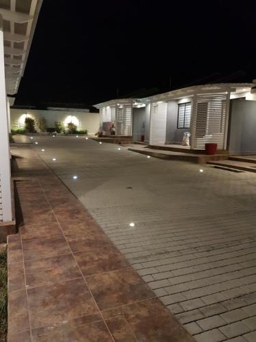 an empty parking lot at night with lights on it at Cabañas Vientos del Mar in Pichilemu