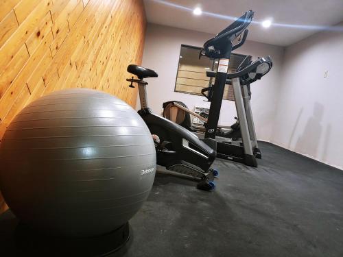 a gym with an exercise ball and an exercise bike at Days Inn by Wyndham Rawlins in Rawlins