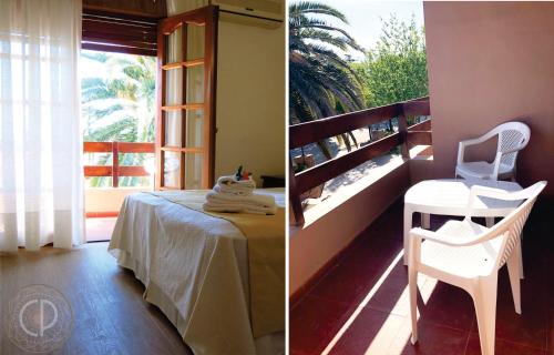 Habitación con mesa, silla y ventana en Casa Piedra Hotel en Villa Carlos Paz