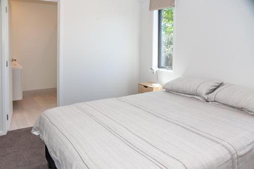 Ένα ή περισσότερα κρεβάτια σε δωμάτιο στο Rolki House - Hanmer Springs Holiday Home