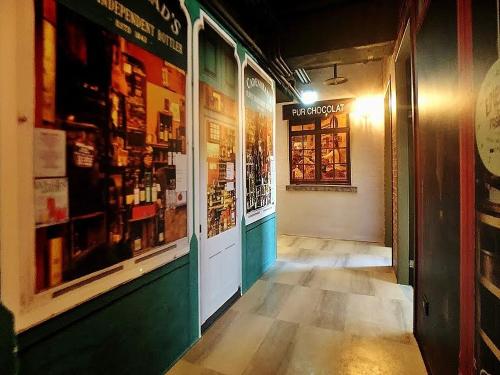 a hallway of a store with a window at Journey Town Inn in Taipei