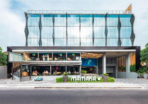 a large building with a large clock on the front of it at MAMAKA by Ovolo in Kuta