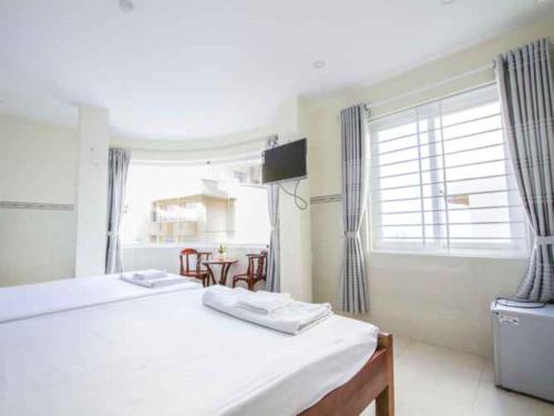 Кровать или кровати в номере Hoang Phat Hotel