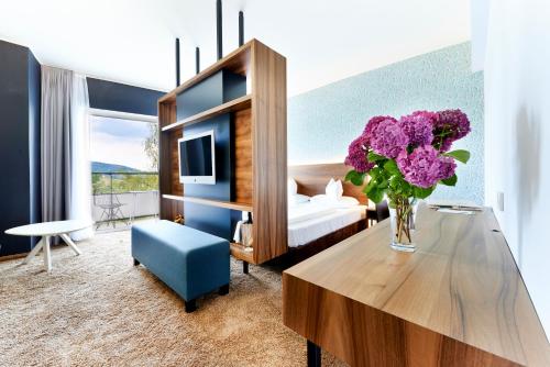 Area soggiorno di Parkhotel Pörtschach - Das Hotelresort mit Insellage am Wörthersee