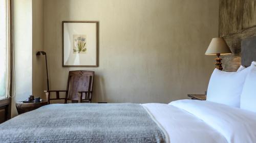 Katil atau katil-katil dalam bilik di Sunyata Hotel. Deqin Meili