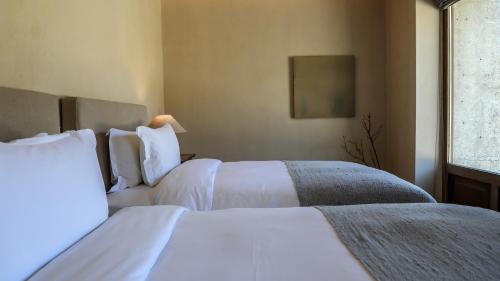 Katil atau katil-katil dalam bilik di Sunyata Hotel. Deqin Meili