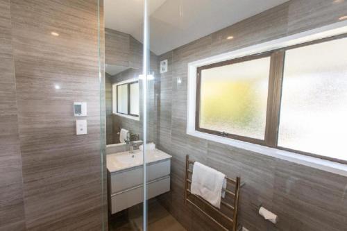 a bathroom with a sink and a window at Mountain Views, Nice Spot Newly renovated in Lake Tekapo