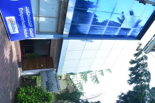a building with a view of a swimming pool at Emporium Hotel in Mangalore