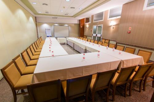 a large conference room with a long table and chairs at Hotel Europa in Albacete