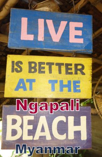 a sign that reads live is better at the national beach istg at Oliver`s Laguna ECO Lodge Hotel in Ngapali