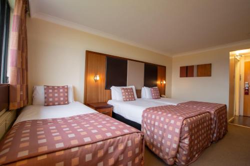 Кровать или кровати в номере Muthu Glasgow River Hotel