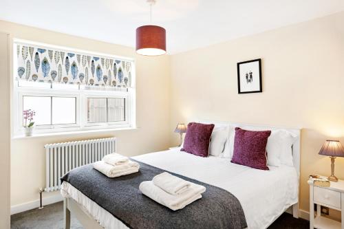 Ένα ή περισσότερα κρεβάτια σε δωμάτιο στο The Harrogate Penthouse