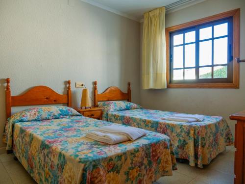 Кровать или кровати в номере Playa Romana Kione Rentals