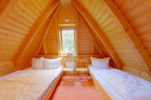 Una cama o camas en una habitación de Strandvogt 2 ES8