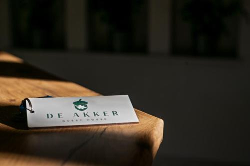 a sign for a coffee shop on a table at De Akker Guest House in Bloemfontein