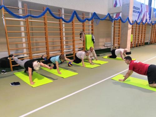 a group of people doing yoga in a gym at Sanatoriy Voronovo in Voronovo