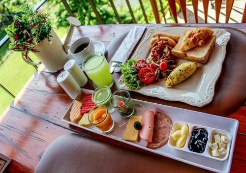 a tray of breakfast foods on a table at La Toscana in Suan Phung