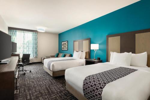 Ένα ή περισσότερα κρεβάτια σε δωμάτιο στο La Quinta by Wyndham Gainesville