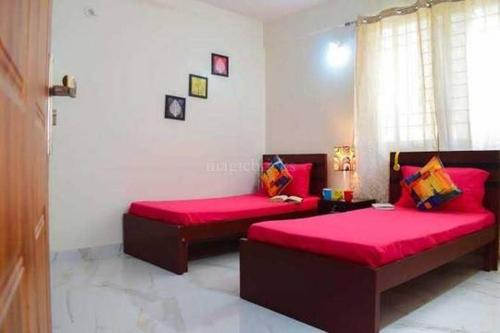 Postel nebo postele na pokoji v ubytování Sakshi Home Stay