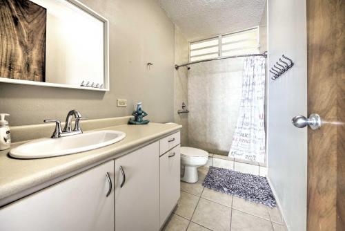 a bathroom with a sink and a shower with a toilet at Rincon Penthouse Steps to Private Beach Oasis! in Rincon