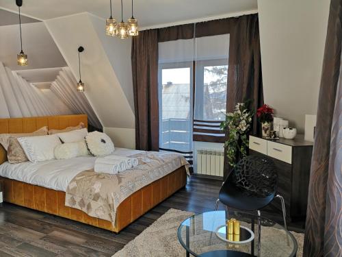 Posteľ alebo postele v izbe v ubytovaní ApartPodhale