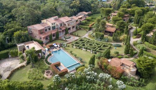 an aerial view of a mansion with a swimming pool at La Toscana in Suan Phung