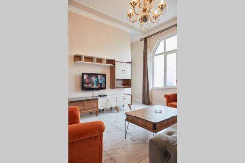 a living room with a couch and a table at Taksim Square Apartment, Great View, Luxury in Istanbul