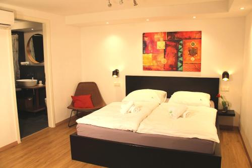 En eller flere senger på et rom på Moderne stilvolle Wohnung im Herzen Münchens
