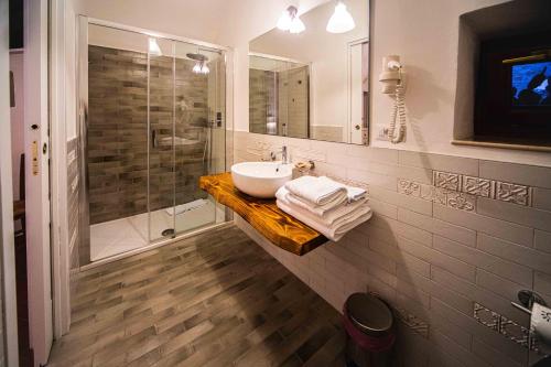a bathroom with a sink and a shower at Masseria Del Crocifisso in Polignano a Mare