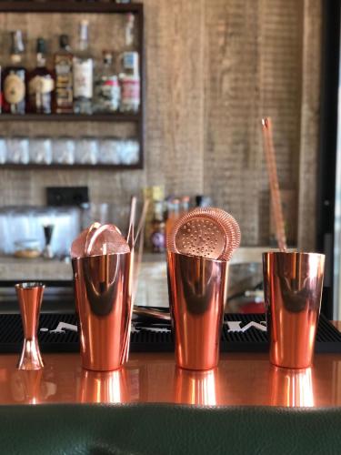 three cups of chocolate milkshakes sitting on a bar at Cal Roure Boutique Hotel in Igualada