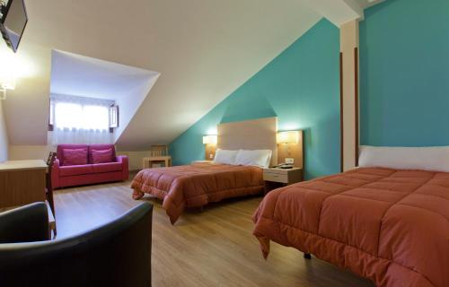 Krevet ili kreveti u jedinici u okviru objekta Hotel Mirador Puerta del Sol
