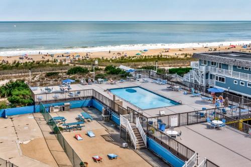 an aerial view of a pool and the beach at Fountainhead Towers in Ocean City