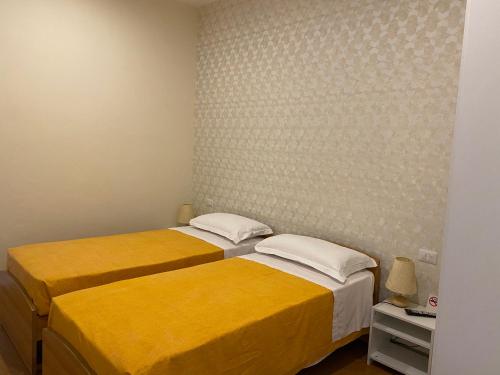 Postel nebo postele na pokoji v ubytování Acquaviva Experience B&B