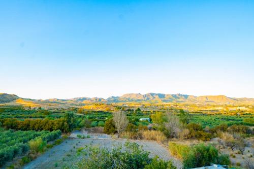 an aerial view of the desert with mountains in the background at Casa Rural Casa Las Flores in Tíjola