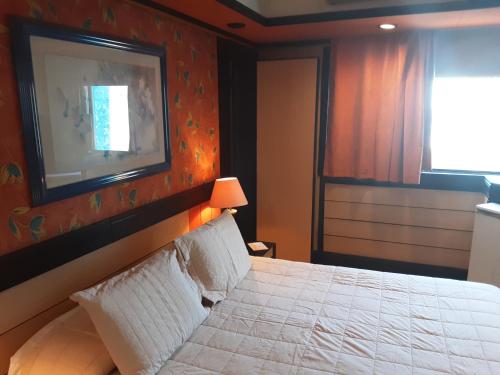 Ein Bett oder Betten in einem Zimmer der Unterkunft Asuncion Internacional Downtown Hotel
