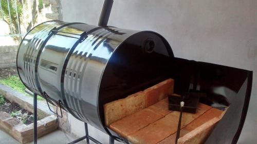 a toaster sitting on top of a brick oven at COMPLEJO DE DPTOS EN RAFAELA a pasitos de la RUTA 34 in Rafaela